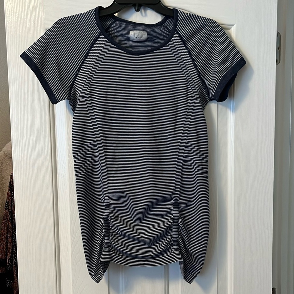 Athleta woman’s navy blue and white striped ruched workout top size S